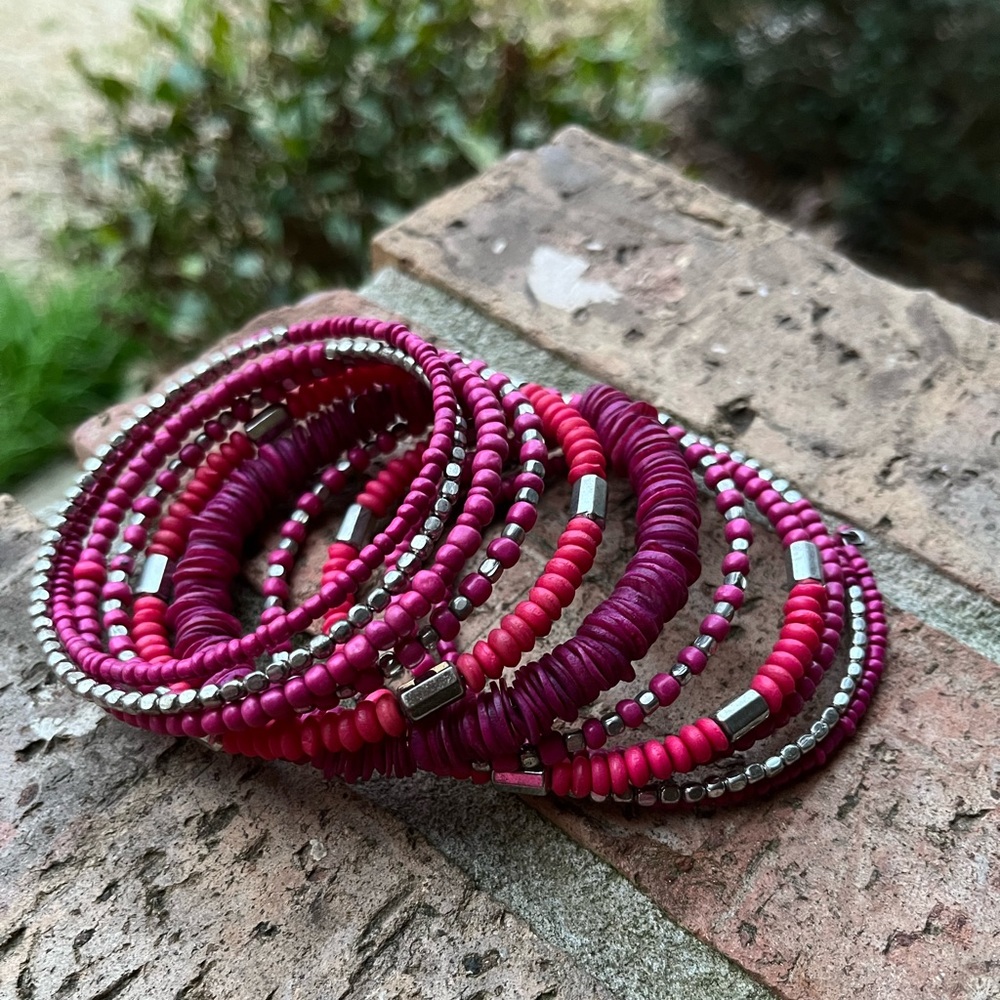 All one piece bracelet. Silver, pink, and purple.